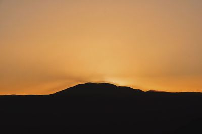 Silhouette of mountain at sunset