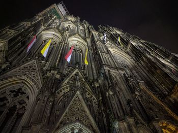 Low angle view of illuminated building at night