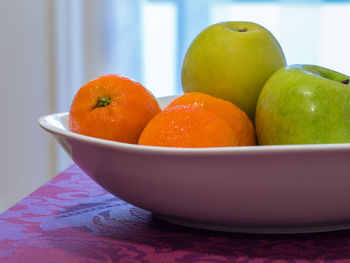 Close-up of fruits in bowl on table