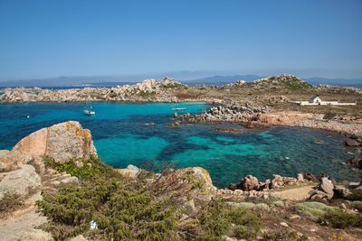 Scenic view of sea against clear blue sky