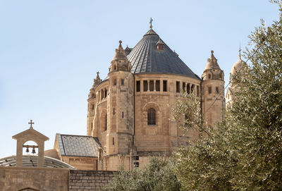 Low angle view of historic building against clear sky