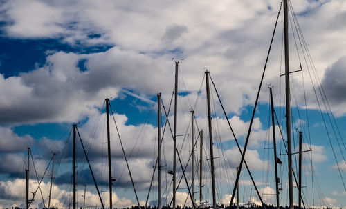 Low angle view of sailboat in sea against sky