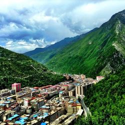 Scenic view of mountains against cloudy sky