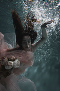 Woman swimming in water