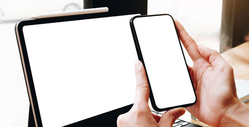 Close-up of hands holding mobile phone