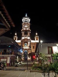 Low angle view of illuminated buildings at night