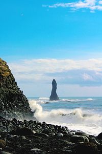 Scenic view of sea against blue sky