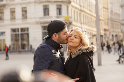 Young couple on street in city