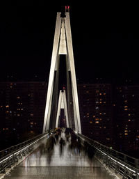 Low angle view of suspension bridge at night