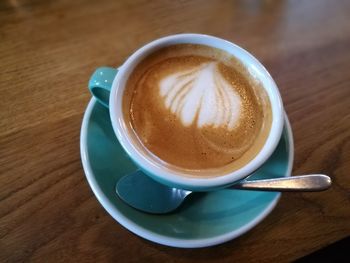 High angle view of cappuccino on table