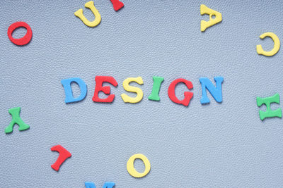 High angle view of colorful foam text on table