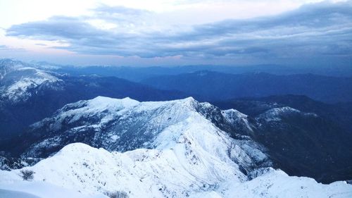 Scenic view of snowcapped mountains against sky