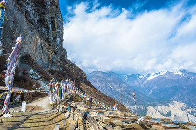 Scenic view of mountains against cloudy sky