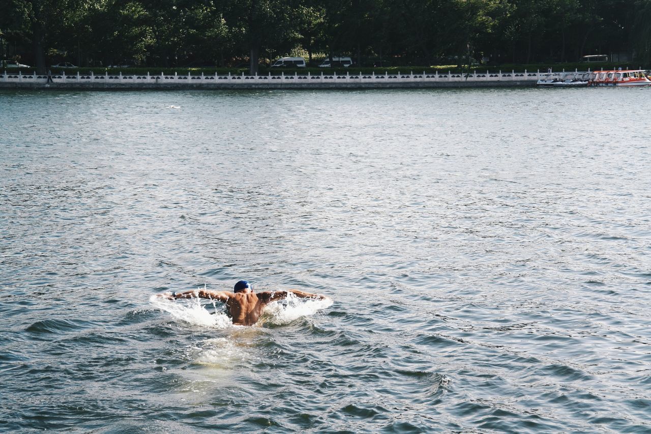 water, waterfront, leisure activity, lifestyles, rippled, men, sea, swimming, vacations, nature, adventure, enjoyment, tranquility, nautical vessel, scenics, beauty in nature, tranquil scene, day