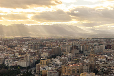 High angle view of buildings against sky during sunset