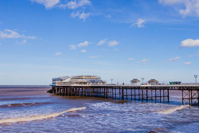 Pier over sea against sky