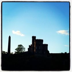 Low angle view of built structure against blue sky