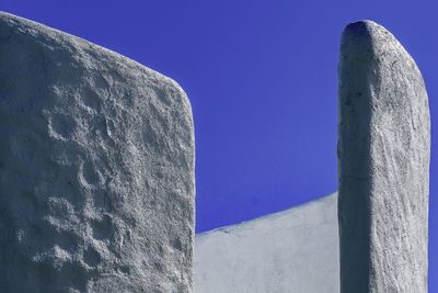 Low angle view of historic building against blue sky