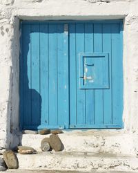 Closed blue doors of building