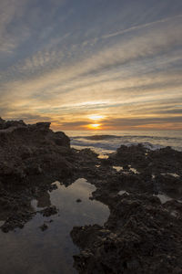 Scenic view of sea against sky during sunset