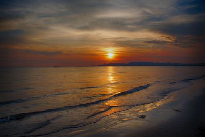 Scenic view of sea against sky at sunset