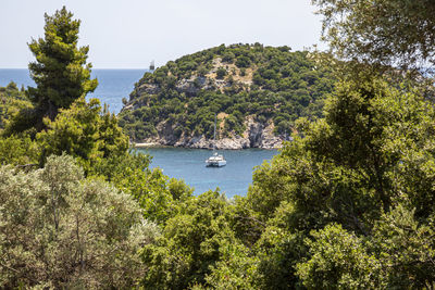 Bay view of a greece island with cliffs and clear water in aegean sea.