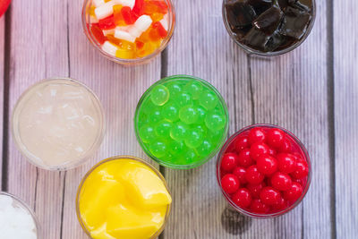 High angle view of multi colored glass on table