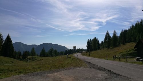 Empty road leading towards mountains