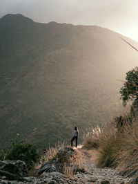 Man looking at mountain