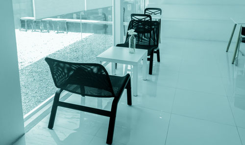 High angle view of chairs on table at home