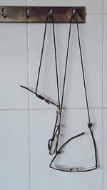 Low angle view of broken glass hanging on wall