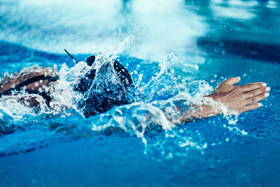 Woman swimming in pool during competition