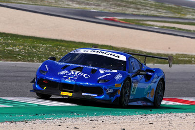 View of blue car on road