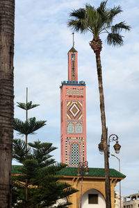 Low angle view of clock tower against sky