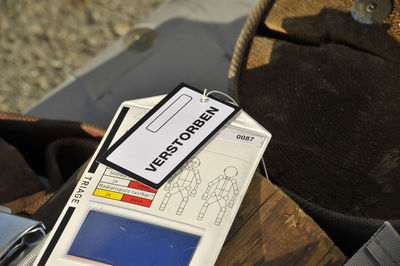 High angle view of information sign on table