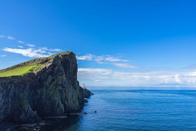 Scenic view of sea against blue sky