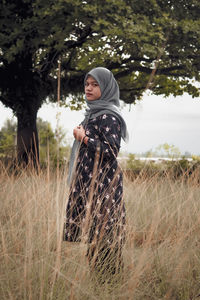 Full length of man standing on field