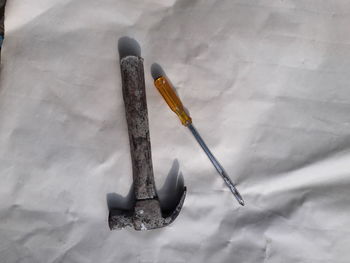 High angle view of metallic structure on wood