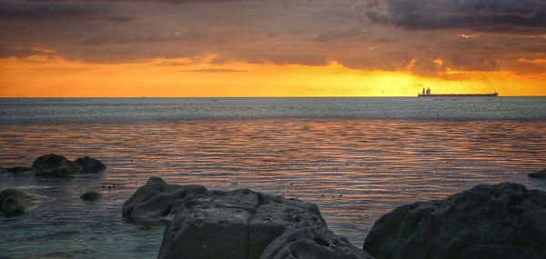 Scenic view of sea against sky during sunset