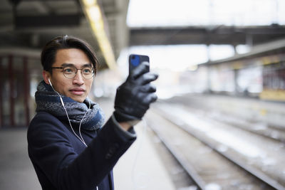 View of man standing at train platform