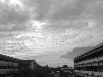 Low angle view of building against cloudy sky