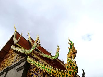 Low angle view of statue against sky