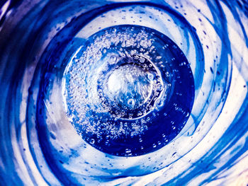 Full frame shot of blue glass with water