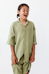 Young man standing against white background