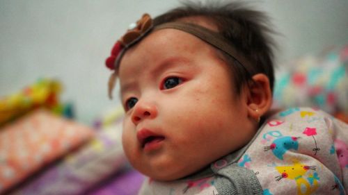 Portrait of cute baby girl at home