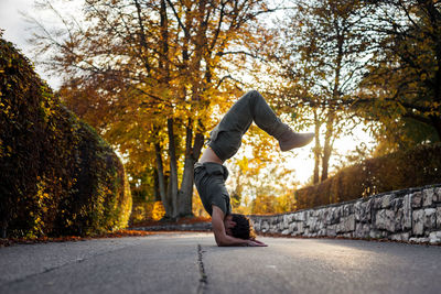 Full length of man skateboarding in park during autumn