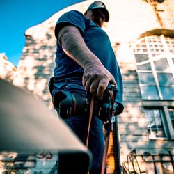 Low angle view of man standing in city