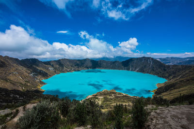 Scenic view of lake against cloudy sky