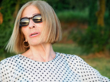 Portrait of young woman wearing sunglasses