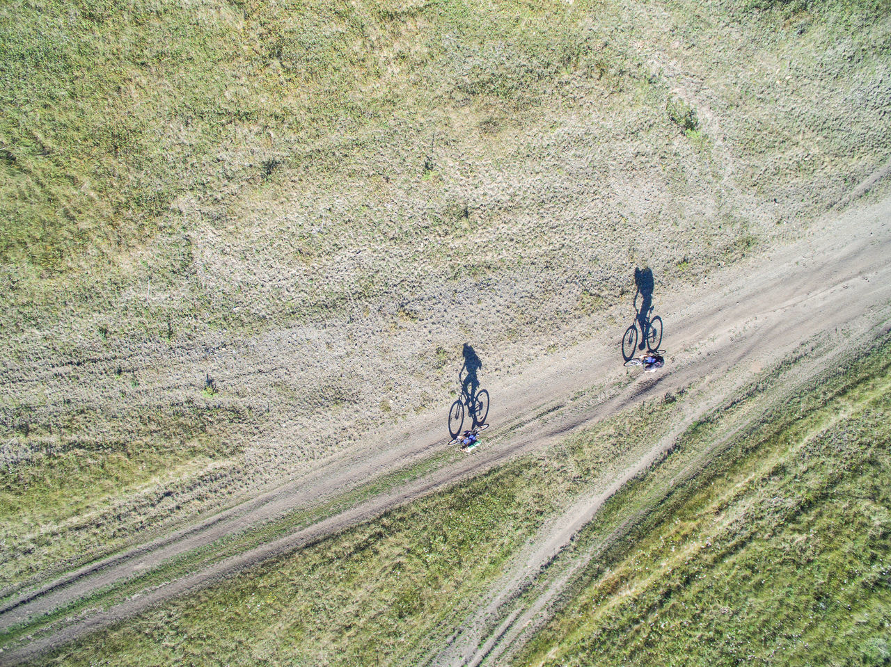 High angle view of people cycling on field